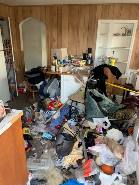 A kitchen with garbage thrown all over it.